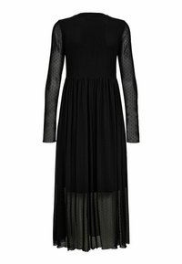 Rochie neagră cu mâneci lungi din material transparent, cu un model cu puncte și o fustă fluidă. Materialul pare ușor și semi-transparent.