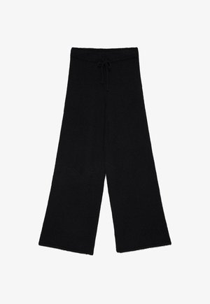 Črne hlače širokih nogavic iz mehkega, teksturiranega materiala. Imajo elastičen pas z vrvico za zategovanje. Preprost, minimalističen dizajn.