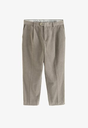 Šviesiai rudos spalvos kordūriniams kojiniams, kurie turi vertikalias juostas, mygtukų užsegimą ir raukšles. Audinys turi minkštą tekstūrą ir laisvą siluetą.