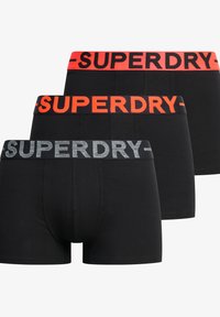 Trois paires de slip noir avec des ceintures élastiques contrastées : une rouge, une noire et une argentée. Design simple et matériau polyvalent.