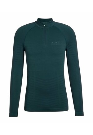 Haut à manches longues, bleu sarcelle foncé, avec une fermeture éclair quart de zip. Présente des rayures texturées sur les côtés et le logo "FALKE" sur la poitrine. Design lisse et ajusté.