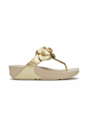 Sandale compensée beige avec bride entre les orteils, décorée d'accents floraux superposés sur la tige, et une semelle matelassée.