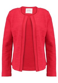 Red textured jacket with a round neckline, open front, and long sleeves. Features a smooth inner layer and subtle embroidered accents.