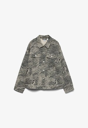 Must ja beežikirju sebramustriga jakk, millel on esil nööbitav sulg, kaks rinnataskut klapiga ja nööpidega, pikad varrukad ja terava kraega.