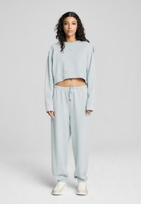 Puma DARE TO GYM RELAXED WASHED CREW - Sudadera - frosted dew