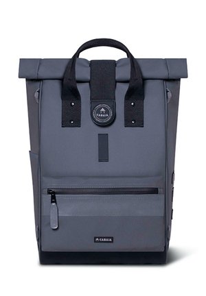 Gray roll-top backpack made of durable fabric, featuring adjustable shoulder straps, front zip pocket, and a round logo patch.
