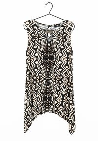 Černobílý top bez rukávů s geometrickými vzory, který má klíčovou dírku a korálkové zdobení v oblasti krku. Měkká textura.