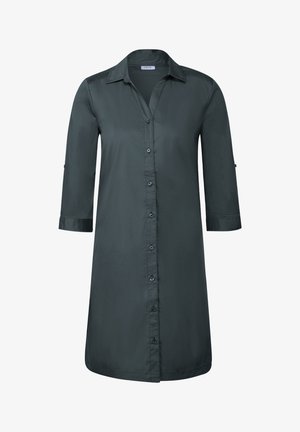 Tummanharmaa nappikauluspaita, jossa on kolme neljäsosaa hihat ja sileä rakenne. Edessä napitusyksityiskohtia.