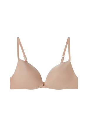 Beige vadderad behå med justerbara band, slät textur och trekantig koppform. Inga märkbara mönster eller hårdvarudetaljer.