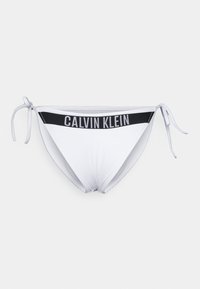 Biele bikiny s čiernym pásom značky Calvin Klein, s viazaním po stranách a hladkým textilným povrchom.