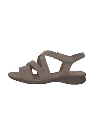 Beige women's sandal featuring multiple wide straps, adjustable ankle strap, cushioned footbed, and a low wedge heel.