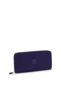 Rectangular dark purple zippered wallet with Kipling logo patch centered, textured fabric, and zipper pull with attached key charm.