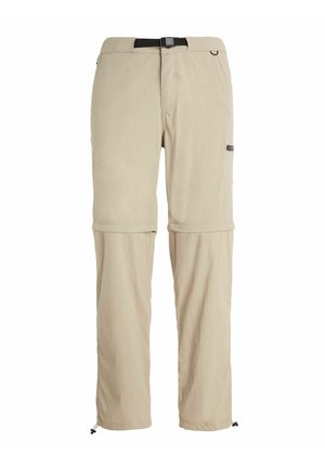 Beige afneembare broek gemaakt van lichtgewicht stof, met een verstelbare tailleband, zijzakken en koordjes bij de pijpen voor een aanpasbare pasvorm.