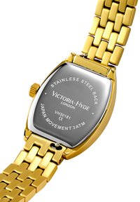 Goldfarbener Armbanduhr mit rechteckigem Edelstahlgehäuse, silberner Rückplatte und gravierten Markendetails. 3 ATM wasserdicht.