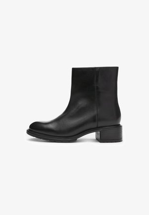 Black leather ankle boot with a round toe, smooth texture, low block heel, and minimalistic design. Durable rubber sole visible.