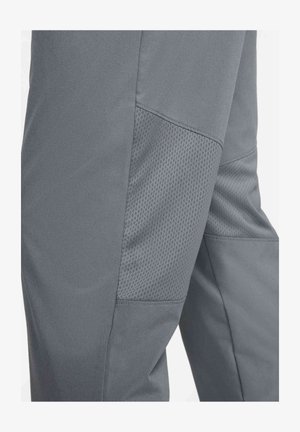 Pantaloni atletici gri, cu un material neted și panouri din plasă pe părți pentru o respirabilitate optimă. Tăietură ajustată cu un talie elastică.