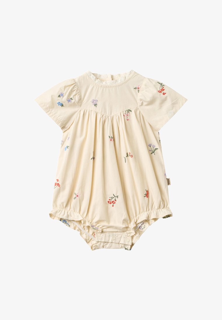 Kreemjas beebitükk lühikeste puhvvarrukatega, väikeste mitmevärviliste lillemustritega, pitsilist detaili krae juures ja snap-lukudega allosas.