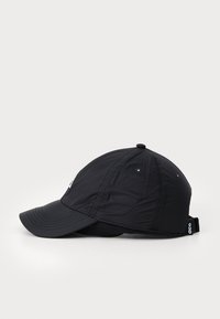 Black baseball cap made of lightweight fabric, featuring a curved brim, adjustable strap at the back, and subtle logo detail on the side.