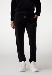 Guess - COUTURE JOGGER PANTS - Pantaloni sportivi - jet black Immagine in miniatura 1