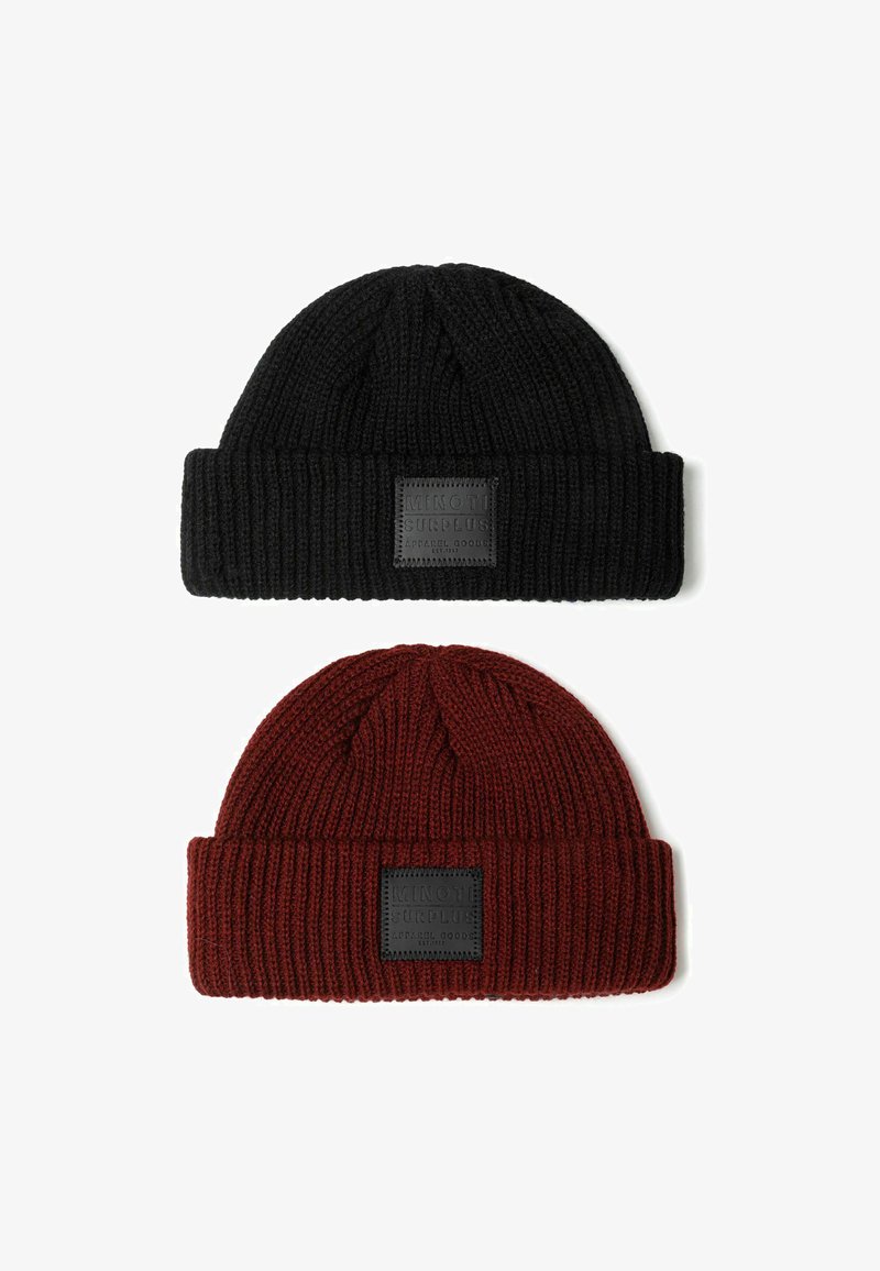 Two knitted beanies: a black one on top and a dark red one underneath. Each features a foldable cuff and a square label on the front.