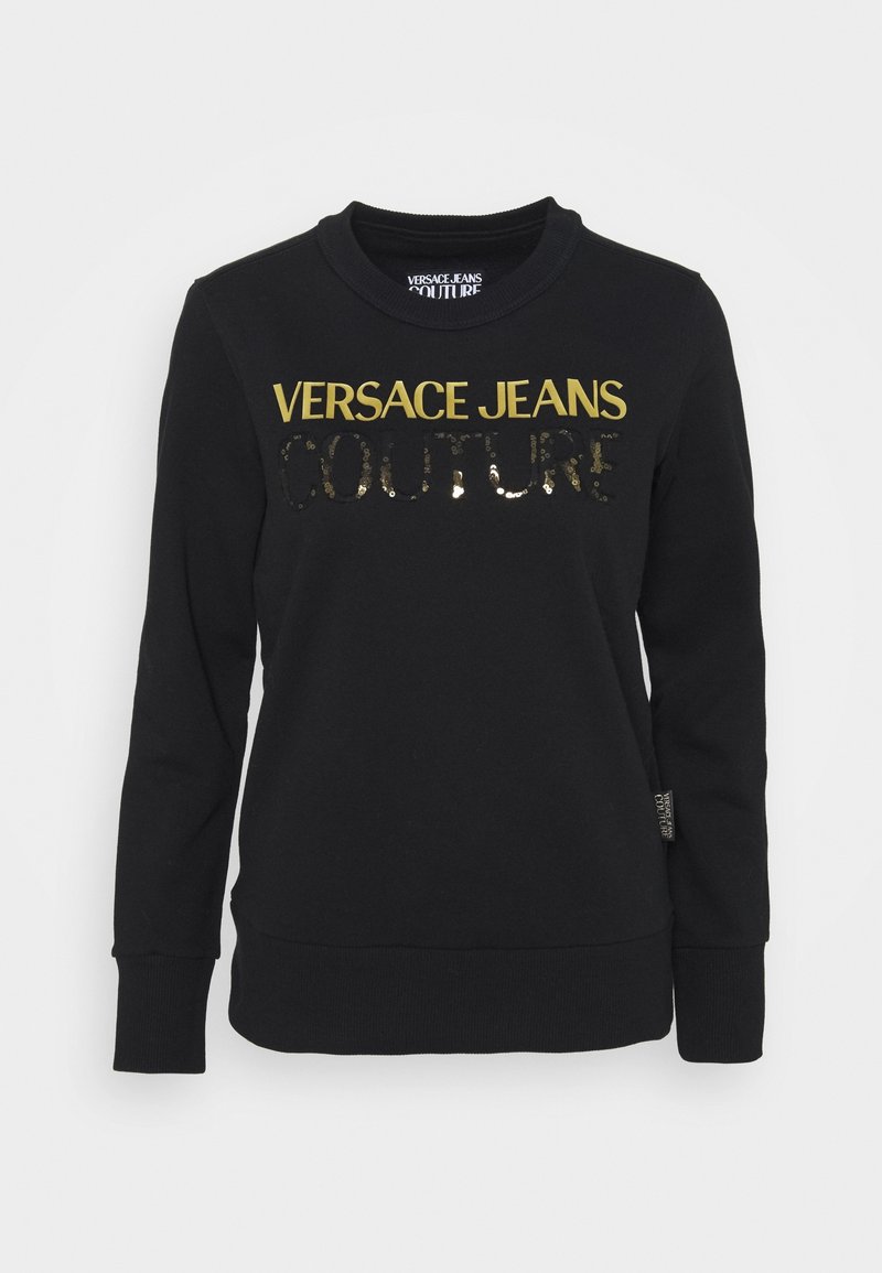 Sweat-shirt noir en coton avec col rond, arborant des lettres dorées "VERSACE JEANS COUTURE" et des détails en sequins sur le devant.