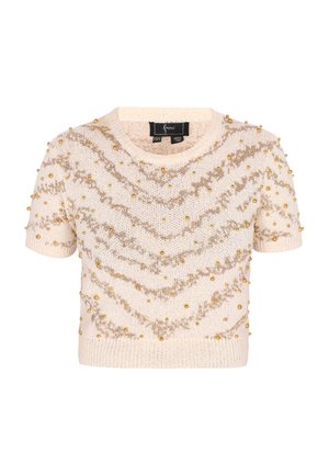 Short-sleeve cream knit sweater with golden bead accents and zigzag patterns. Features a round neckline and a textured fabric.