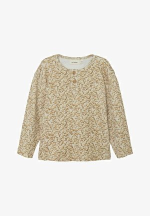 Beżowa koszula z długim rękawem w brązowo-jasnozielony wzór liści, z okrągłym dekoltem i dwoma drewnianymi guziczkami na przodzie.