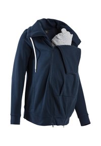 Felpa con zip di color blu navy realizzata in tessuto morbido, dotata di una tasca frontale per il trasportino per bambini e un colletto alto con lacci regolabili.