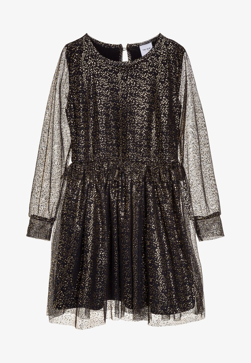 Robe noire avec des paillettes dorées, manches longues transparentes, taille élastique et ourlet à volants. Le dos avec une fermeture en trou de serrure ajoute du détail.