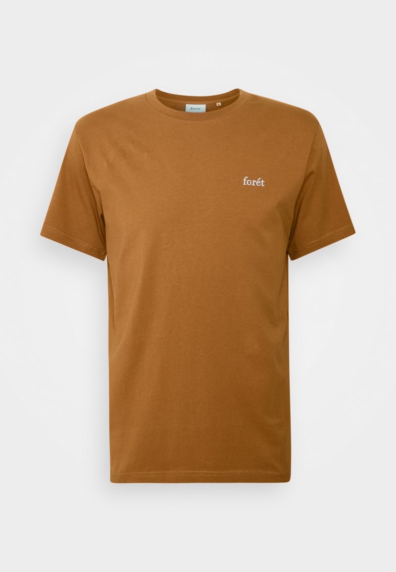 T-shirt en coton marron à manches courtes, avec un col rond et un petit logo blanc « forét » sur la poitrine gauche.