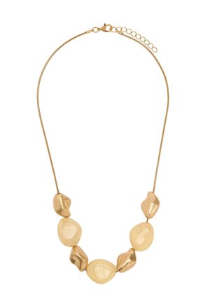 Naszyjnik w kolorze złotym z siedmioma gładkimi, nieregularnymi owalnymi i kamyczkowatymi koralikami na cienkim łańcuszku typu snake z zapięciem karabińczyk i przedłużką.
