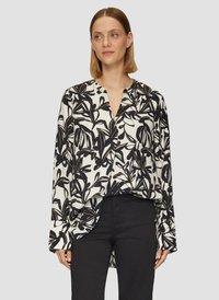 Losse blouse in zwart-wit bloemenprint, met een V-hals, lange mouwen en een high-low zoomontwerp. Een gladde stoftextuur.