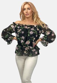 Czarna bluzka bez ramiączek w kwiatowy wzór, z falbanami na mankietach i dołach, z fasonem peplum oraz przezroczystym materiałem zdobionym różowymi i zielonymi kwiatami.