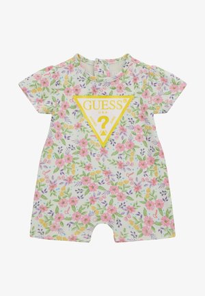 Mameluco infantil con estampado floral en blanco, con mangas cortas, cuello redondo y un logo triangular amarillo con el texto "Guess" en el centro.