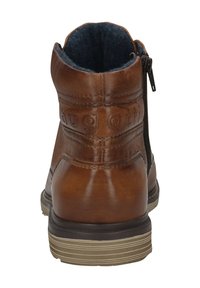 Bruine leren enkelboot met een gestructureerde afwerking, contrasterende donkerblauwe voering, ritssluiting aan de zijkant en een rubberen zool met horizontale groeven.