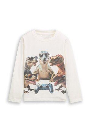 T-shirt bianco a maniche lunghe con una grafica che raffigura quattro dinosauri con occhiali da sole e un controller di videogioco blu al centro.