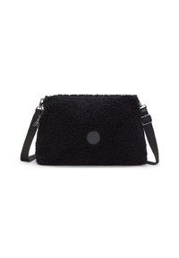 Black textured crossbody bag made from synthetic material. Features a plush exterior, adjustable strap, and a circular logo. Zipper closure.