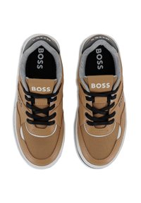 Tan sneakers with mesh and leather material. Features black laces, grey lining, white accents, and "BOSS" branding on the tongue and side.