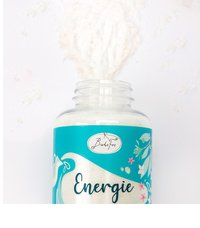 Clear plastic container labeled "Energie" with white powder spilling out against a plain white background.