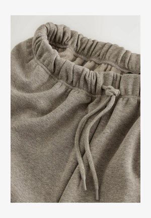 Hallid hallid puuvillased spordipüksid, millel on elastne vöökoht klosetiga tekstuuriga ja reguleeritav pael. Sile ja pehme kangas.