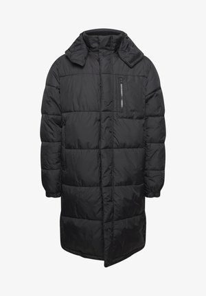 Must must väike kaelusega must puffer jakk, millel on lukuga rinna tasku, tikitud disain, pikad varrukad ja elastsed mansetid.