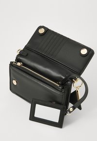 Black leather wallet with gold hardware, featuring an interior zipper pocket, card slots, and a clear ID window. Compact rectangular design.