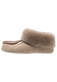 Brown suede slipper with a plush fur cuff, rounded shape, soft texture, and flat sole. Features a small brand label on the side.