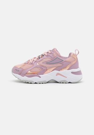 Light pink athletic sneaker with metallic rose gold accents, textile and synthetic material, chunky white sole, and a padded tongue.