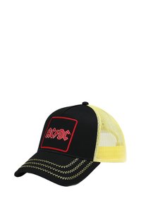 Melnā acu cepure ar dzelteniem akcentiem, priekšpusē ar sarkanu izšūtu AC/DC logo un zigzag šuvēm gar malām.