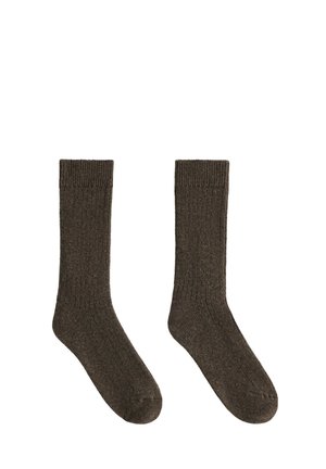 Paire de chaussettes courtes côtelées gris foncé, posées à plat avec les orteils pointant vers le bas sur fond blanc.