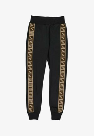 Pantalon de jogging noir avec poignets et taille élastiques, avec des bandes latérales marron décorées de motifs géométriques répétitifs.