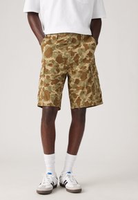 Camo cargo shorts in earthy tones, made of breathable fabric, featuring multiple pockets, a straight cut, and stitched detailing.