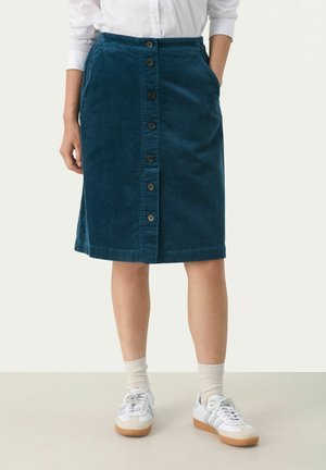 Blå kord kjol med en rak design, med en framknäppning, två sidofickor och en fåll strax under knäet.