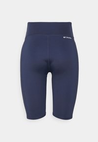 Short de sport bleu marine taille haute avec coutures plates et petit logo Columbia sur le côté gauche près de la ceinture.